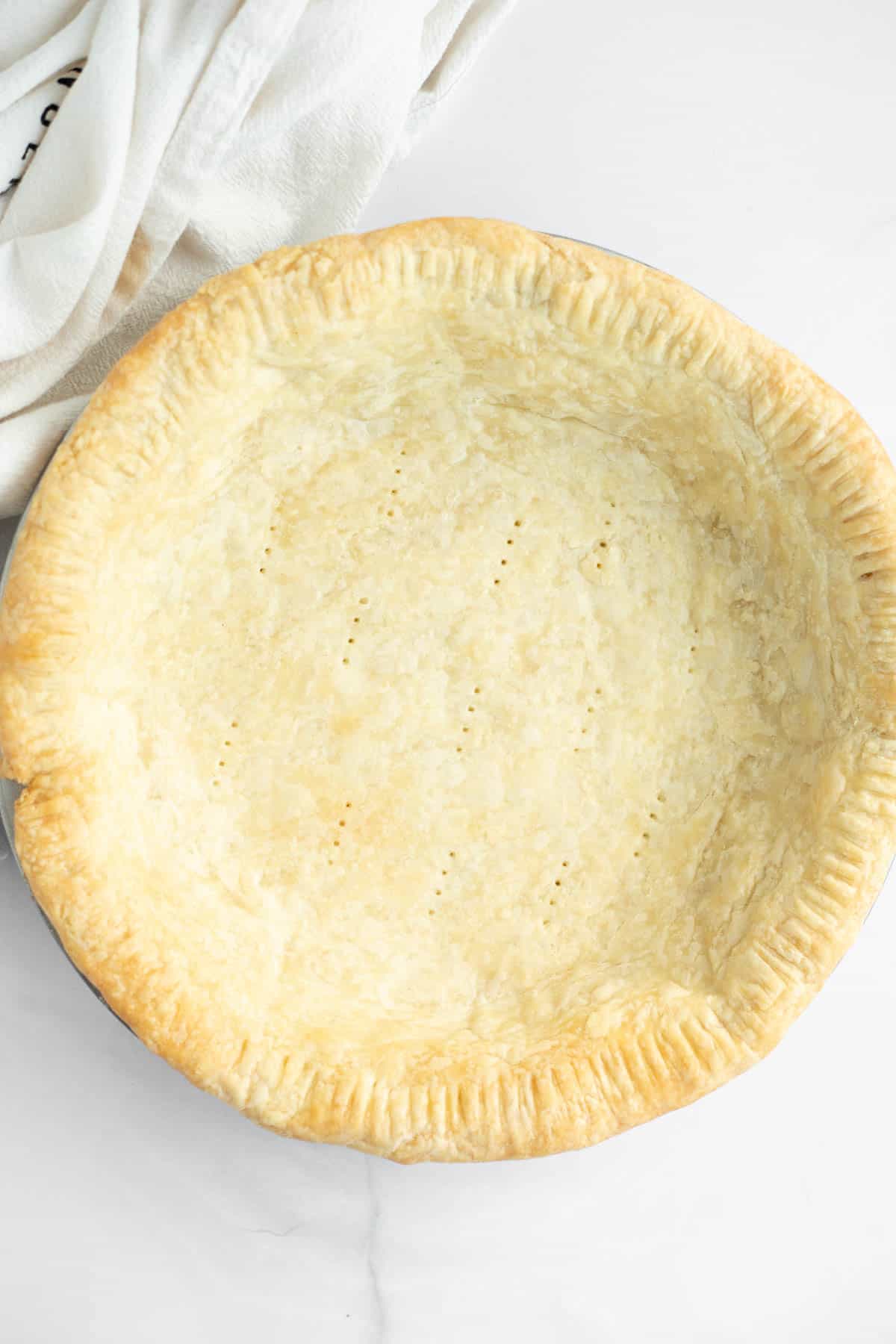 flakey all butter pie crust on a white background.