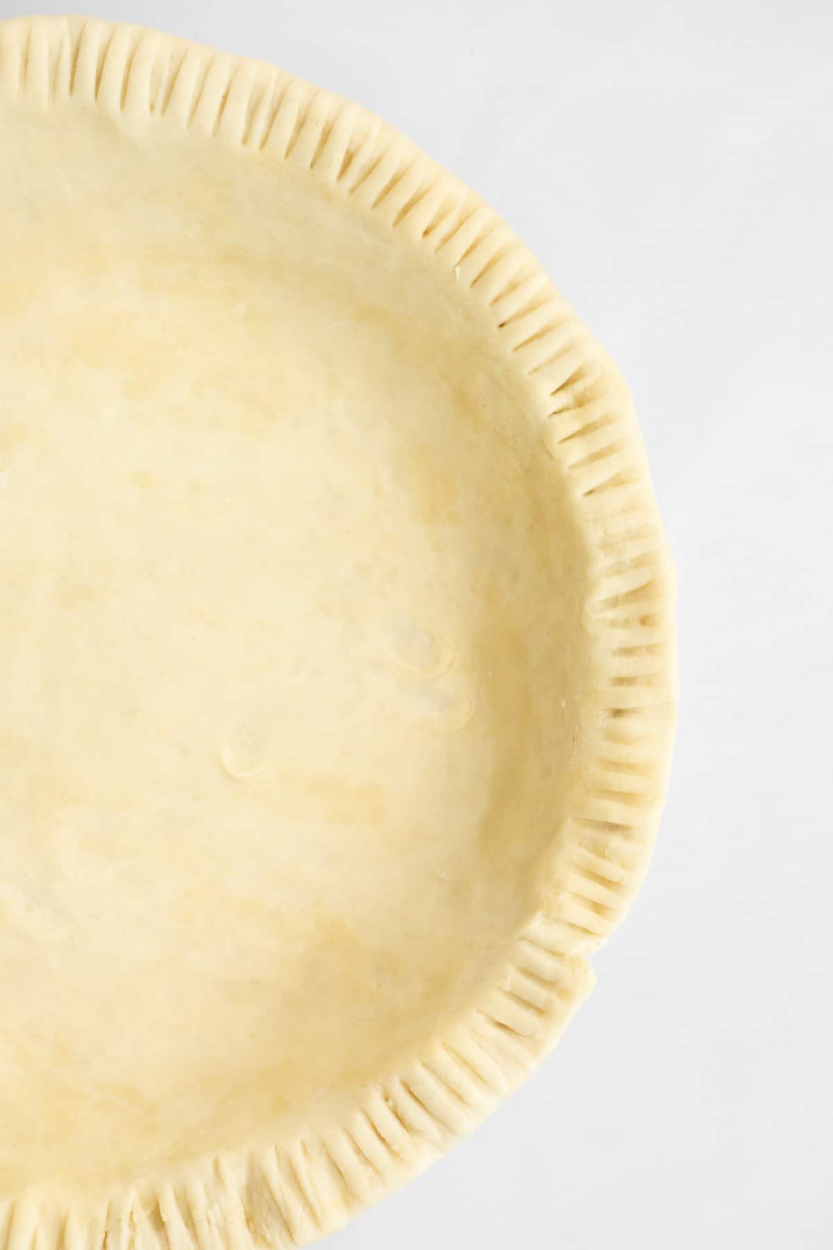 crimpled edge of pie dough.