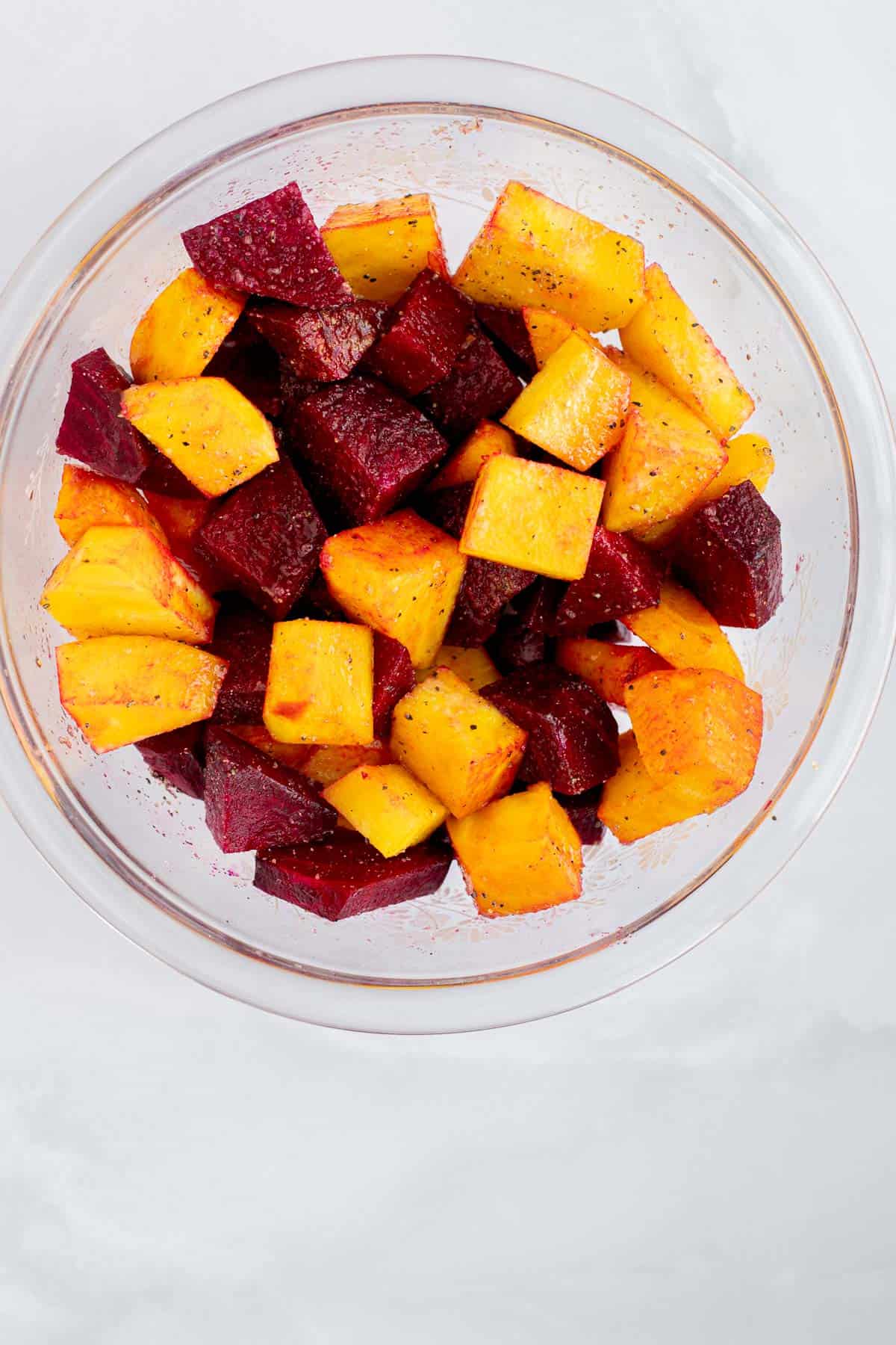 golden and red beets in a glass bowl.