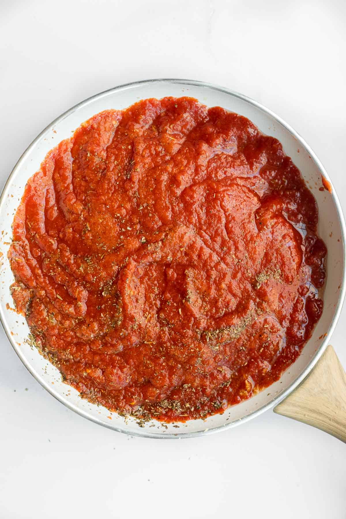 healthy marinara sauce in a white pan.