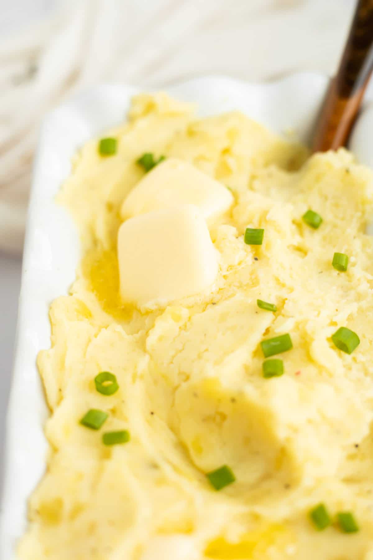 pats of butter on top of milk free mashed potatoes.