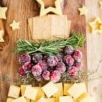 top of a Christmas tree charcuterie board with a star made out of cheese.