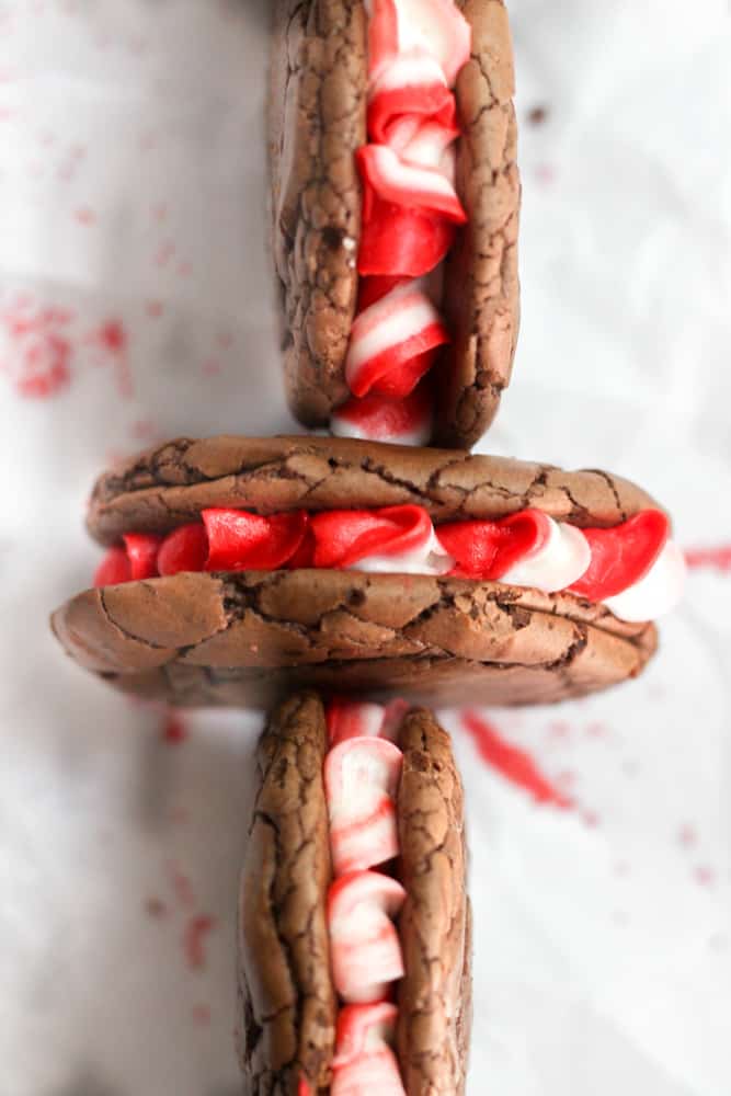 peppermint brownie cookies in a criss-cross pattern on white parchment paper.