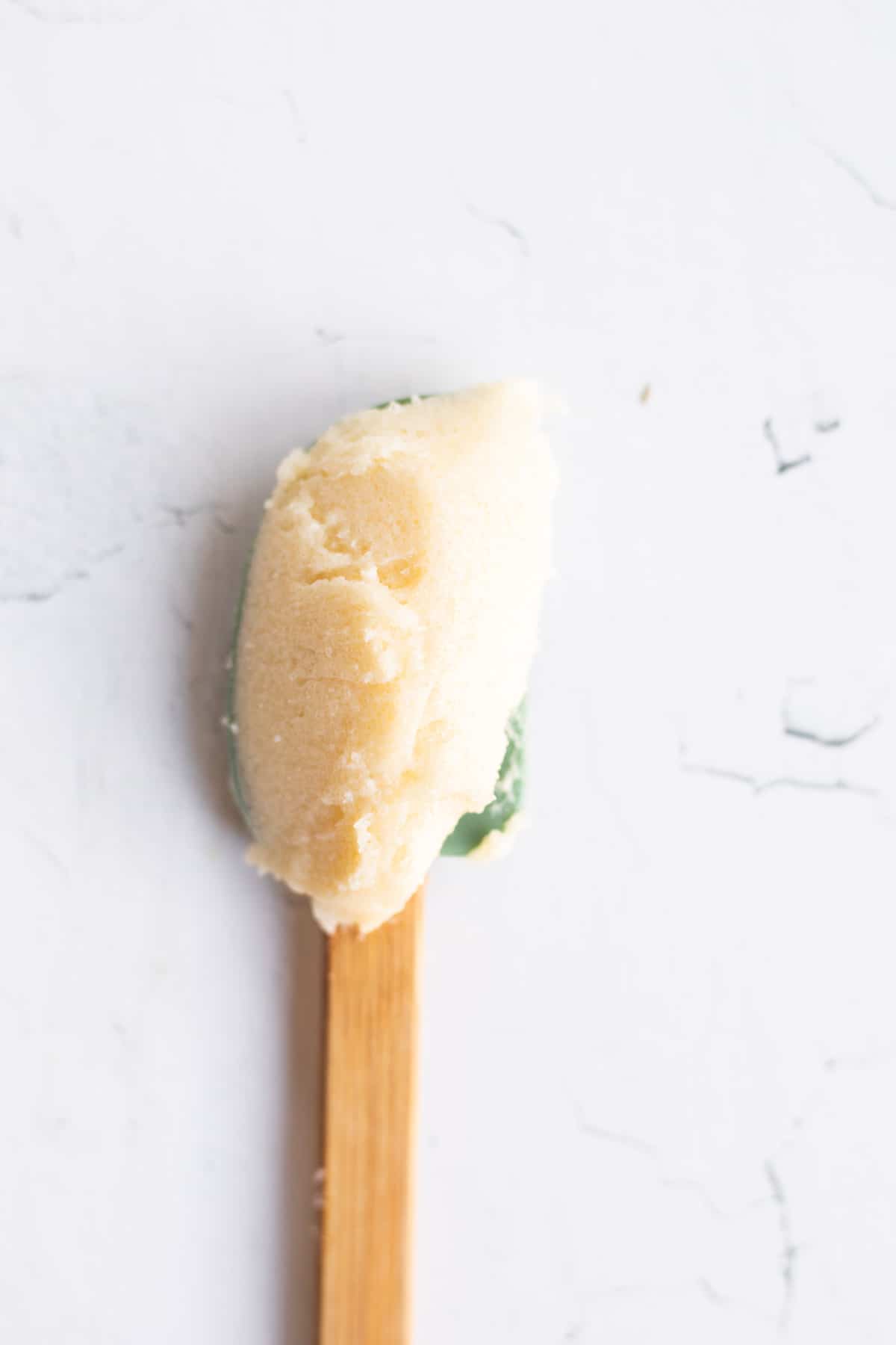 creamed butter and sugar on a small spatula.
