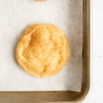 snickerdoodle recipe without cream of tartar baked on parchment paper.