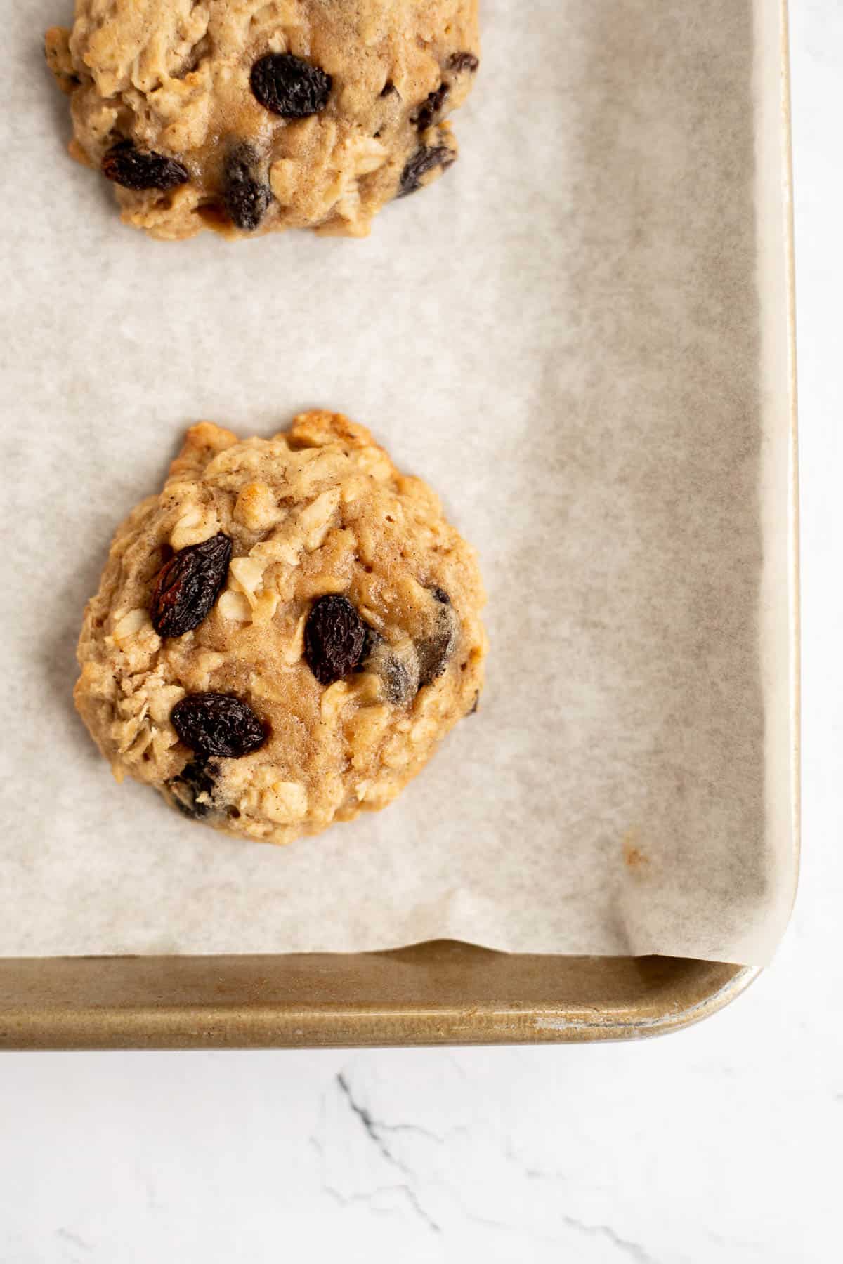 baked oatmeal raisin cookies without eggs on a parchment paper.