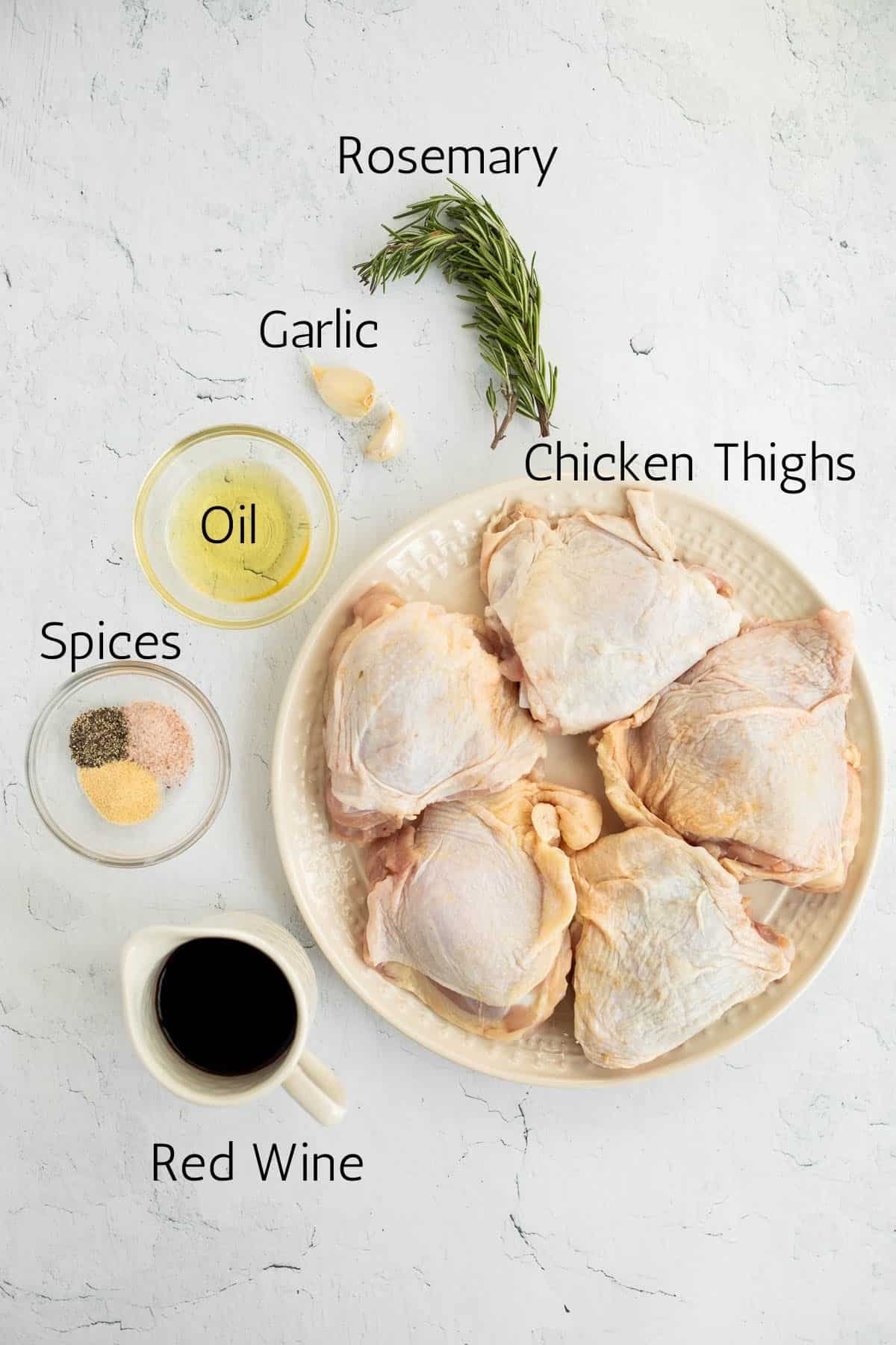 ingredients for pan seared chicken thighs labeled with black text.
