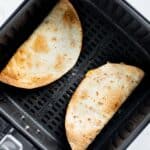 quesadillas cooked in air fryer basket.
