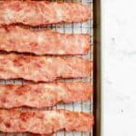 oven baked turkey bacon on wire rack on baking sheet.