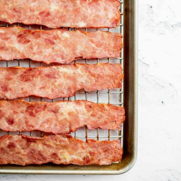 turkey bacon cooked in the oven on a wire rack on a baking sheet.