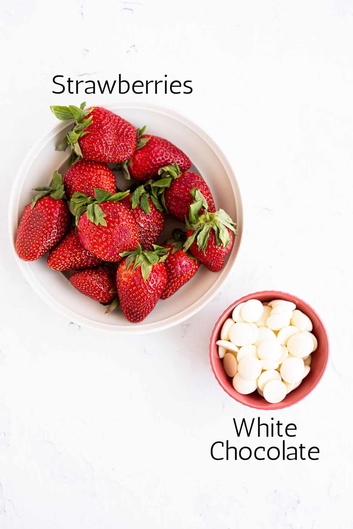 bowl of strawberries and white chocolate chips labeled with black text.