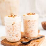 2 Mason jars of pre-made oats with carrots, yogurt, and pecans.