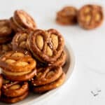 mini pretzel twists with peanut butter smushed between them.