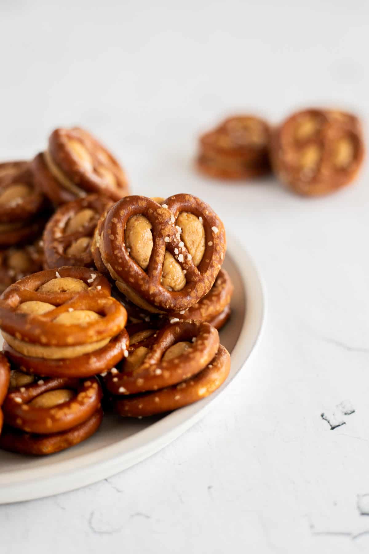 mini pretzel twists with peanut butter smushed between them.