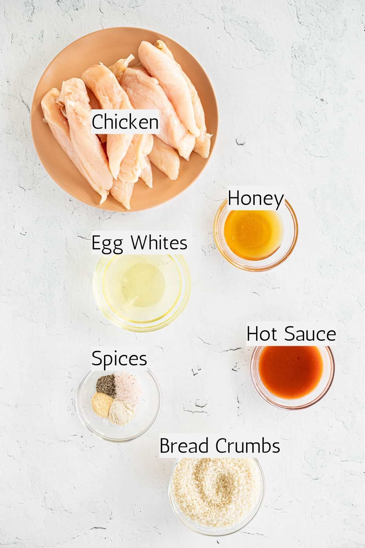 ingredients for hot honey chicken tenders labeled with black text.