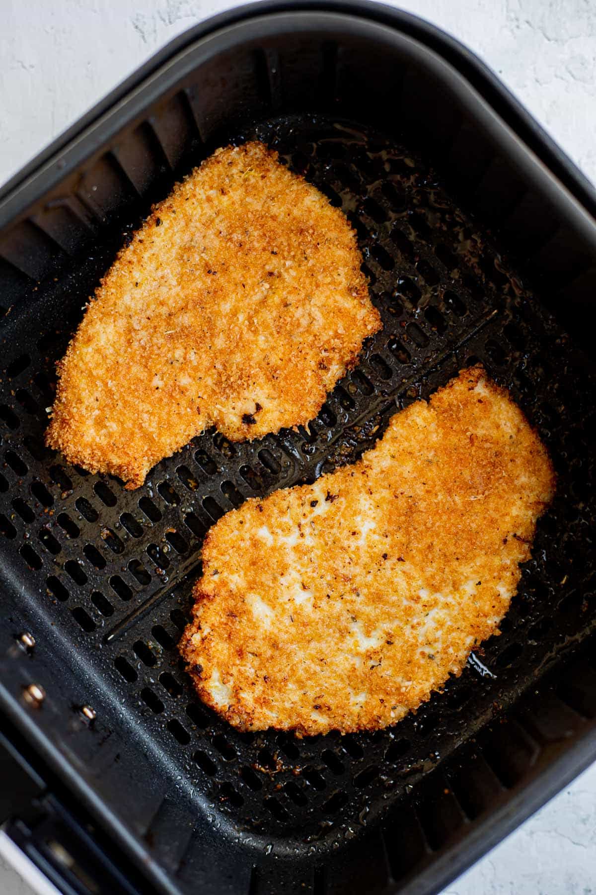 2 chicken cutlets cooked in the air fryer.