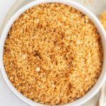 a white bowl filled with homemade gluten free bread crumbs.