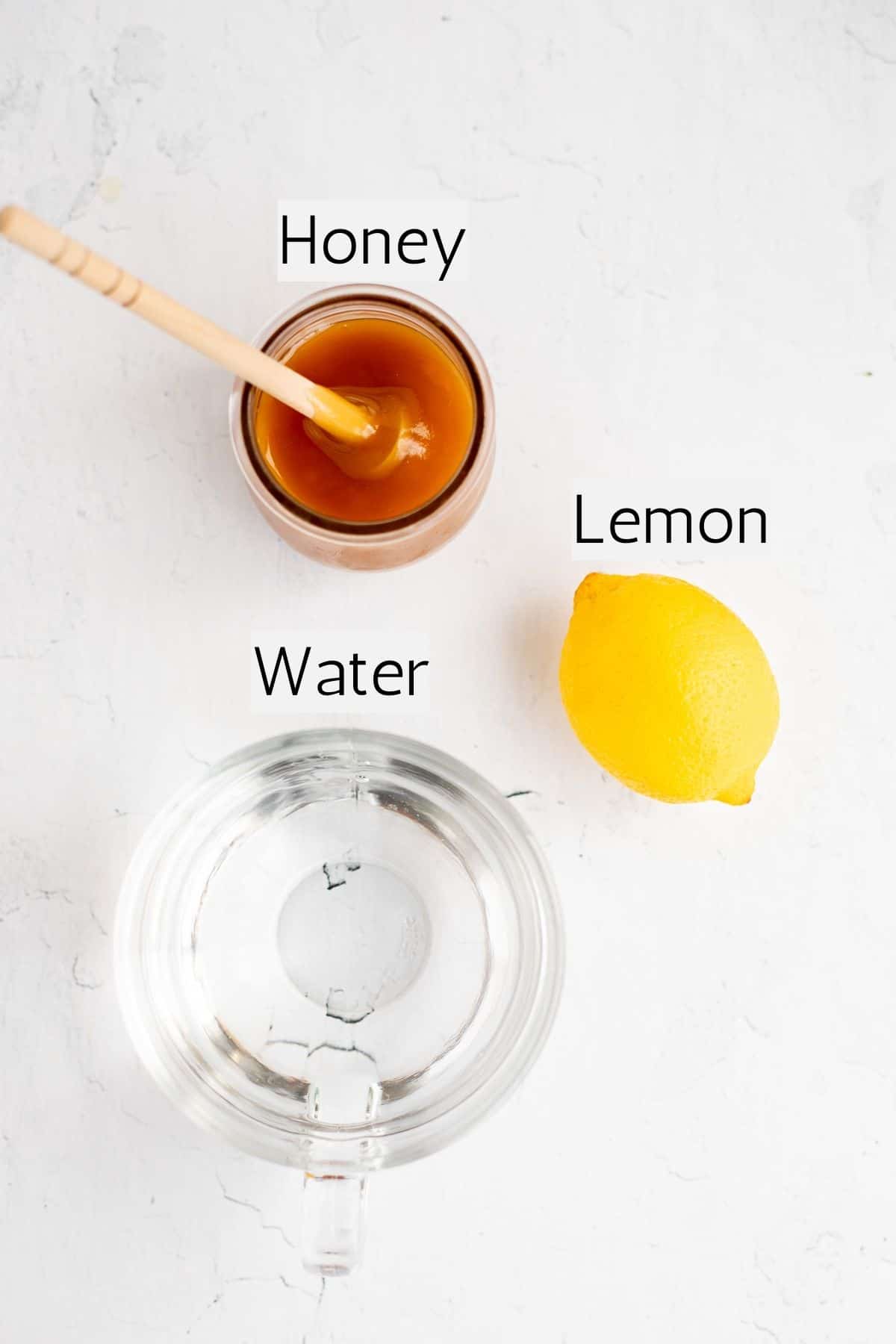 ingredients for honey lemon tea labeled with black text.
