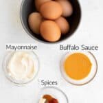 ingredients to make spicy deviled eggs labeled with black text.