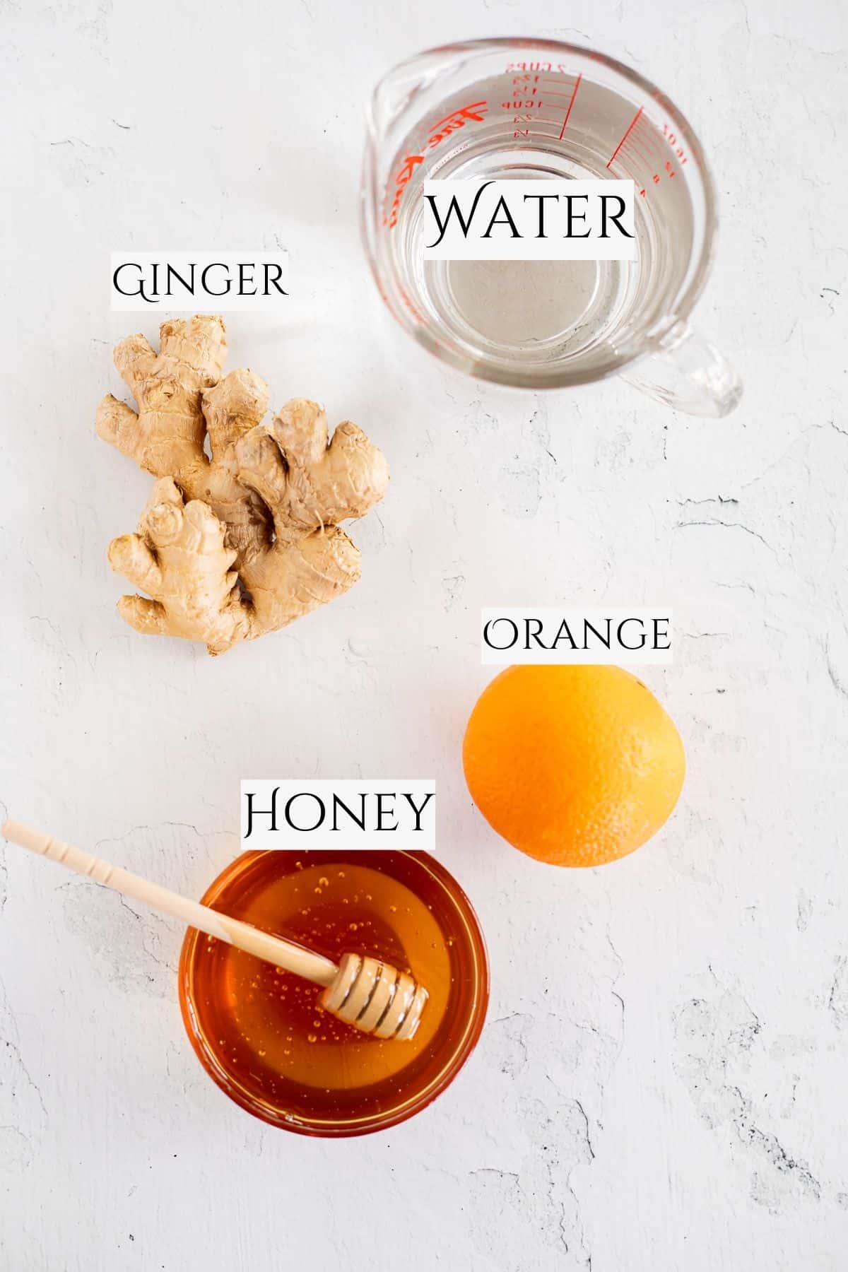 ingredients to make honey ginger tea labeled with black text.