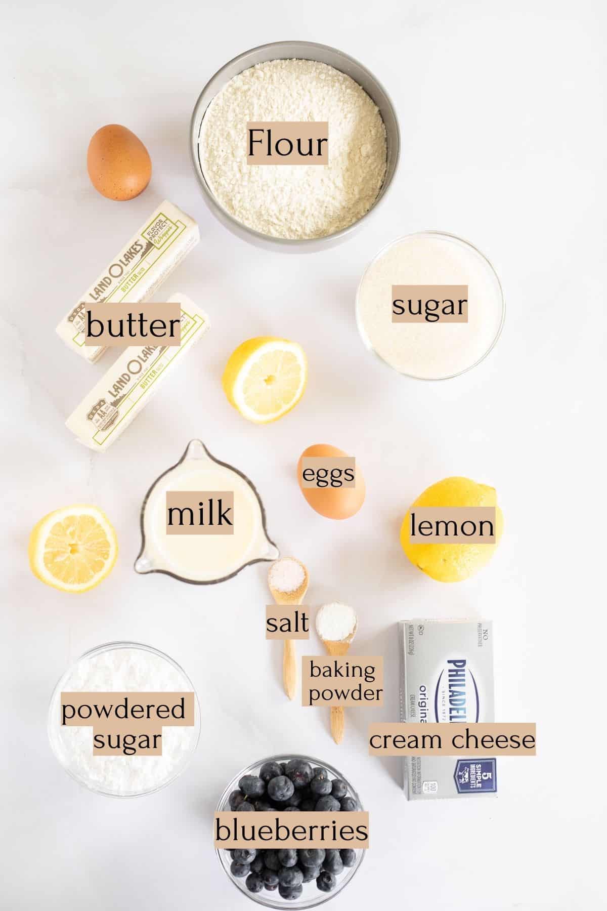 ingredients to make a lemon blueberry sheet cake labeled with tan text boxes.