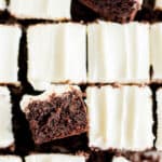 brownies with cream cheese frosting cut into squares.