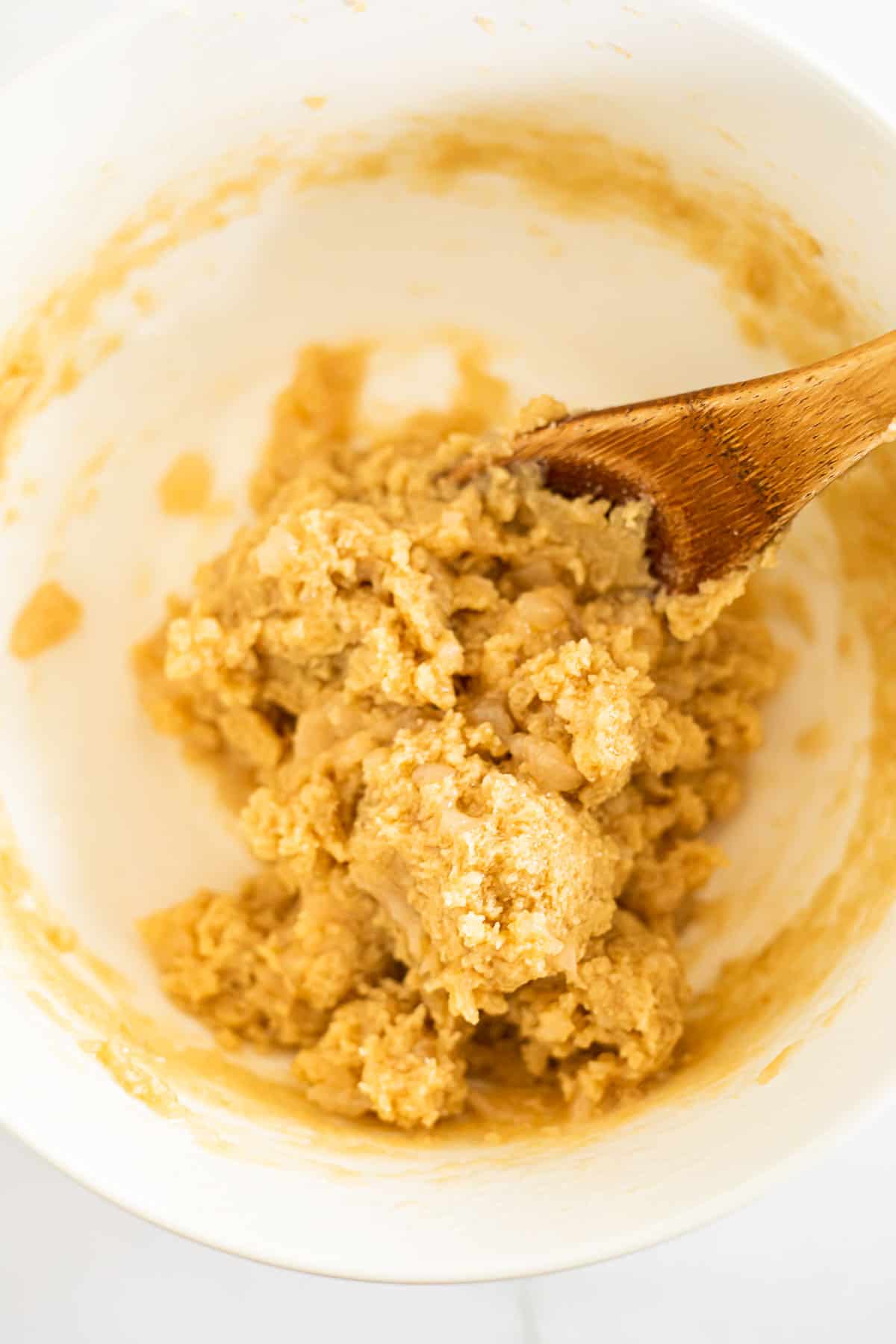 Applesauce, butter, and brown sugar mixed in a white bowl.
