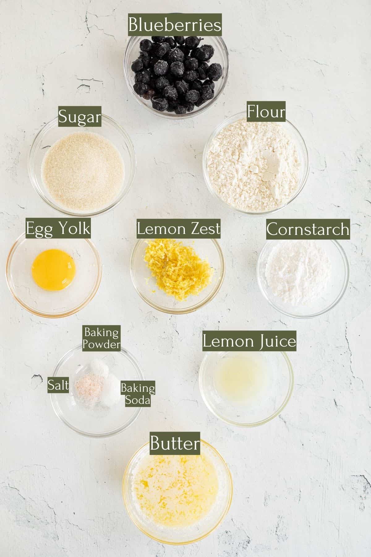 ingredients to make lemon blueberry cookies labeled with green text boxes.