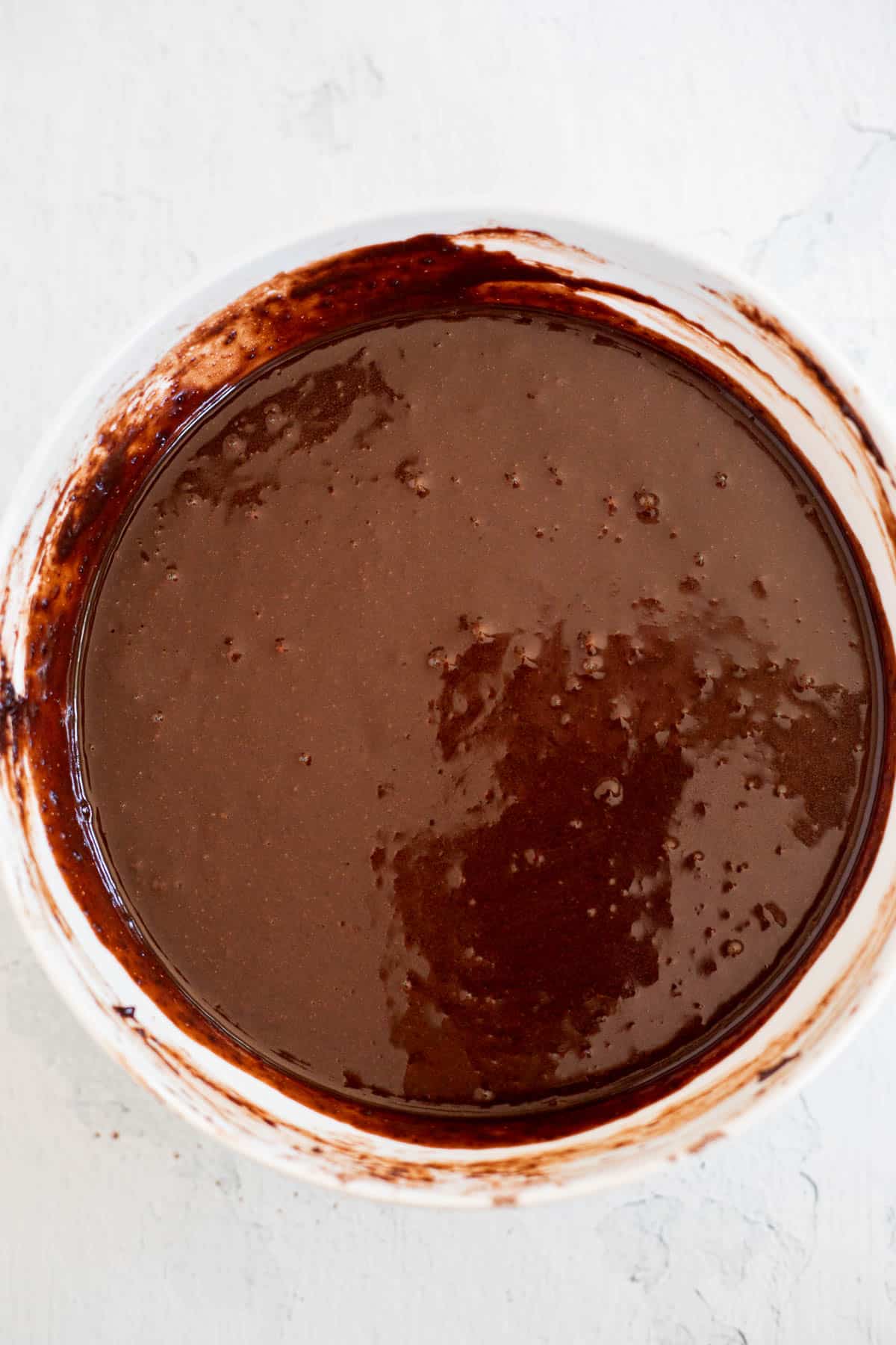 chocolate cake batter in a white bowl.