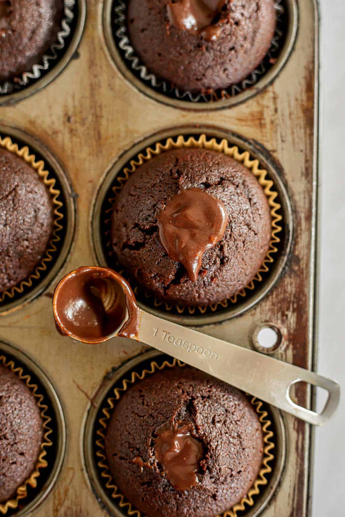 a baked chocolate fudge cupcake filled with chocolate ganache.