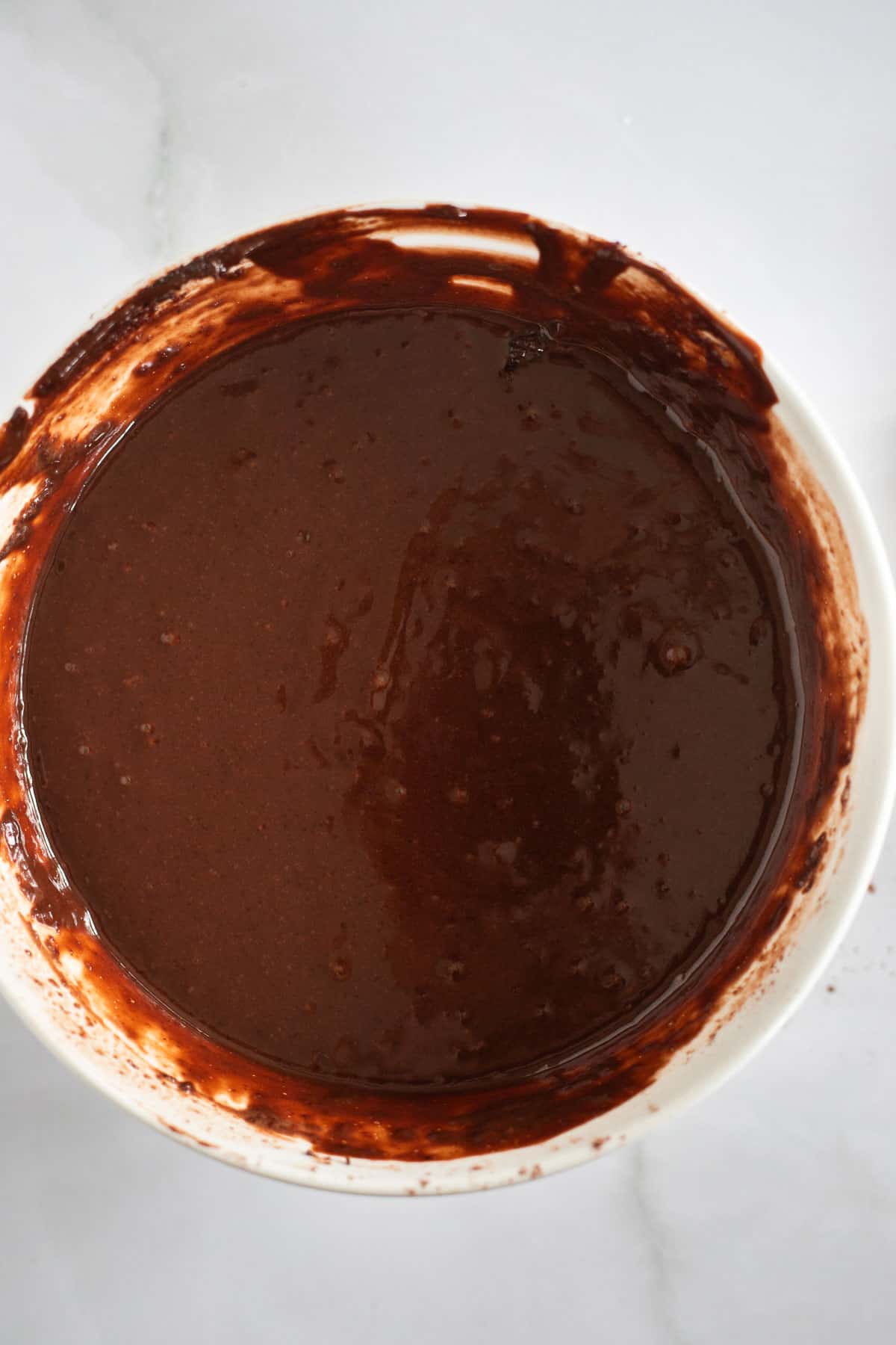 chocolate cupcake batter in a white bowl.
