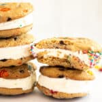 5 M&M ice cream sandwiches stacked with a bite in one.