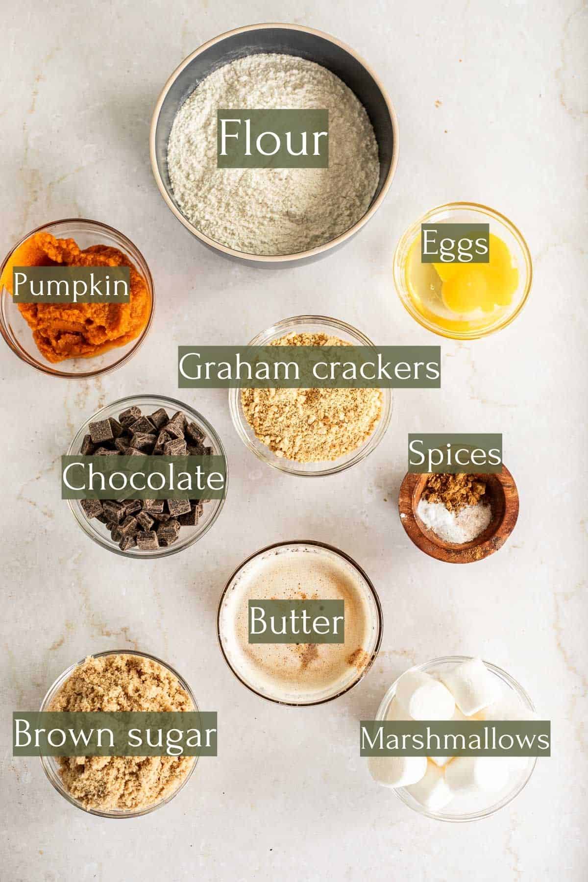 ingredients to make pumpkin s'mores cookies labeled with green text boxes.