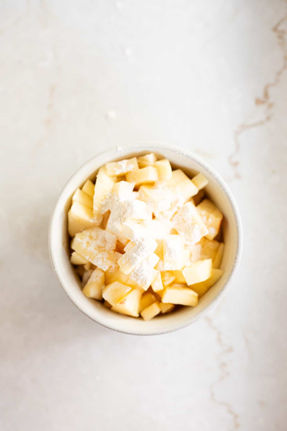 diced apples tossed in flour.
