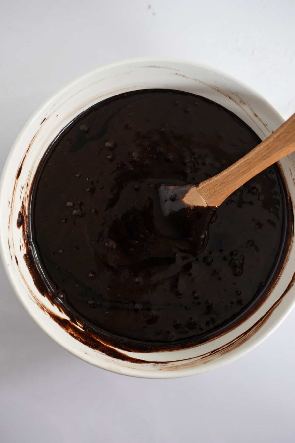 black cocoa cupcake batter in a white mixing bowl.