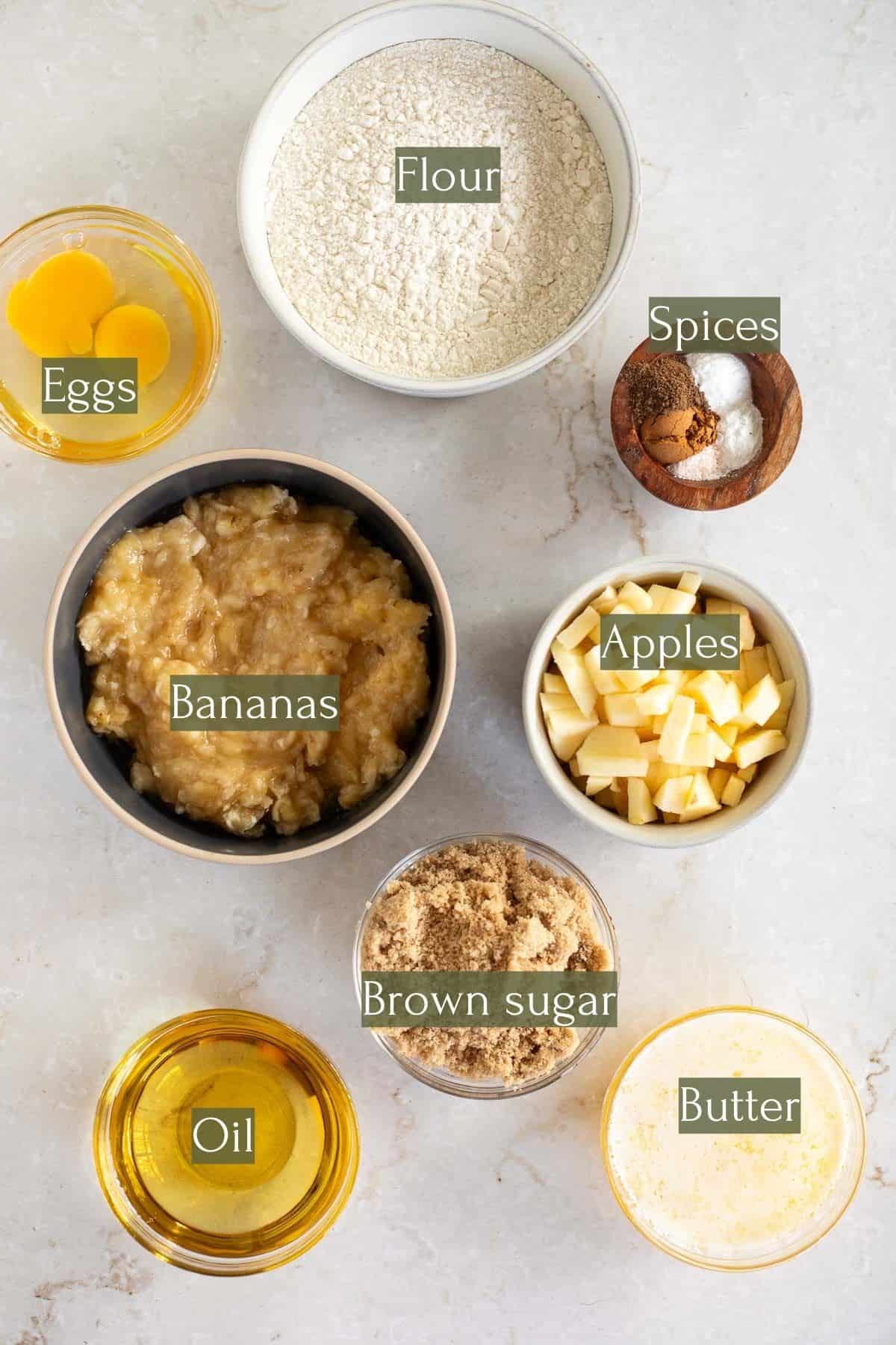 ingredients to make banana bread with apples labeled.