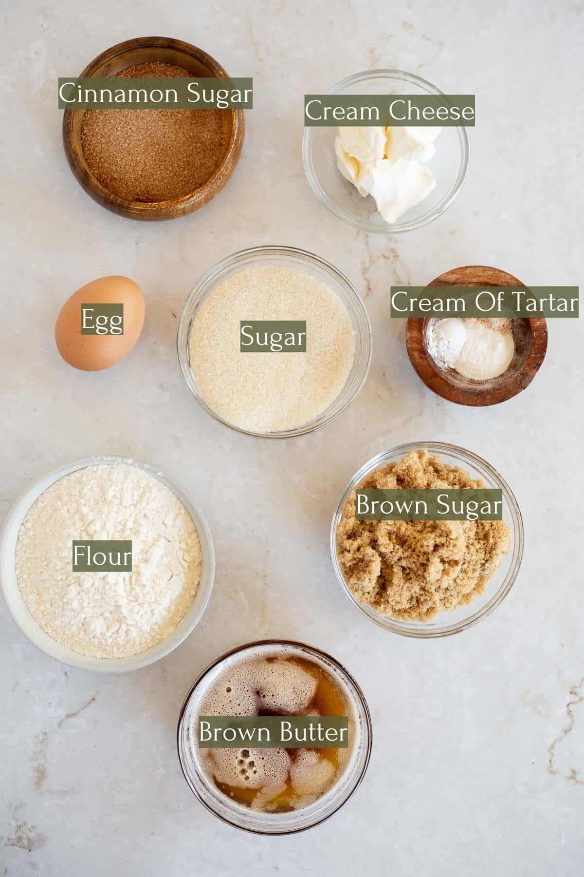 ingredients to make brown butter snickerdoodles labeled with green text boxes.