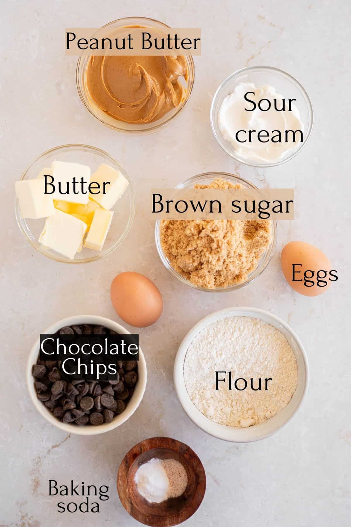 ingredients to make peanut butter sour cream cookies labeled with text.