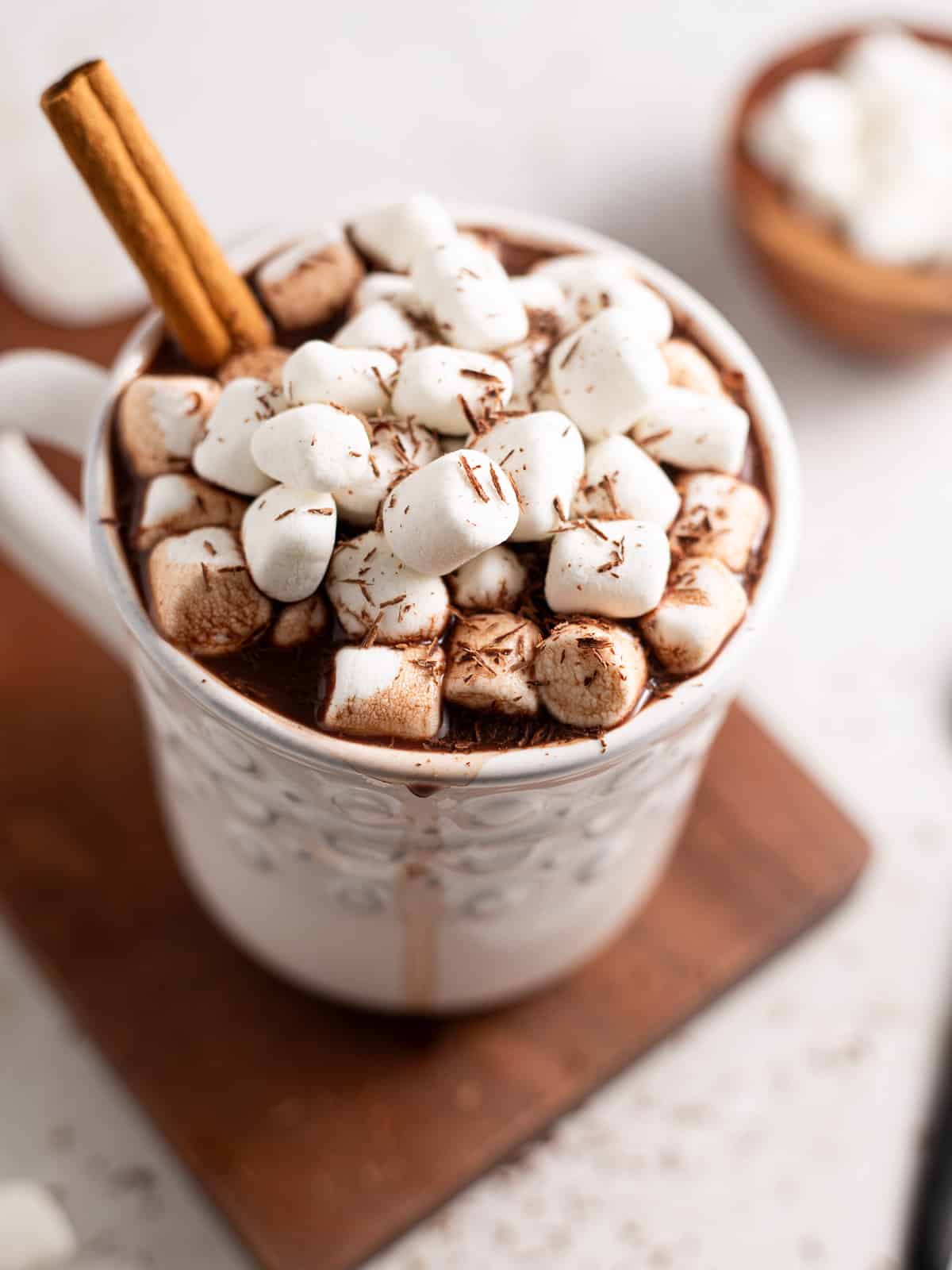 a white mug of gut healthy hot chocolate with marshmallows.