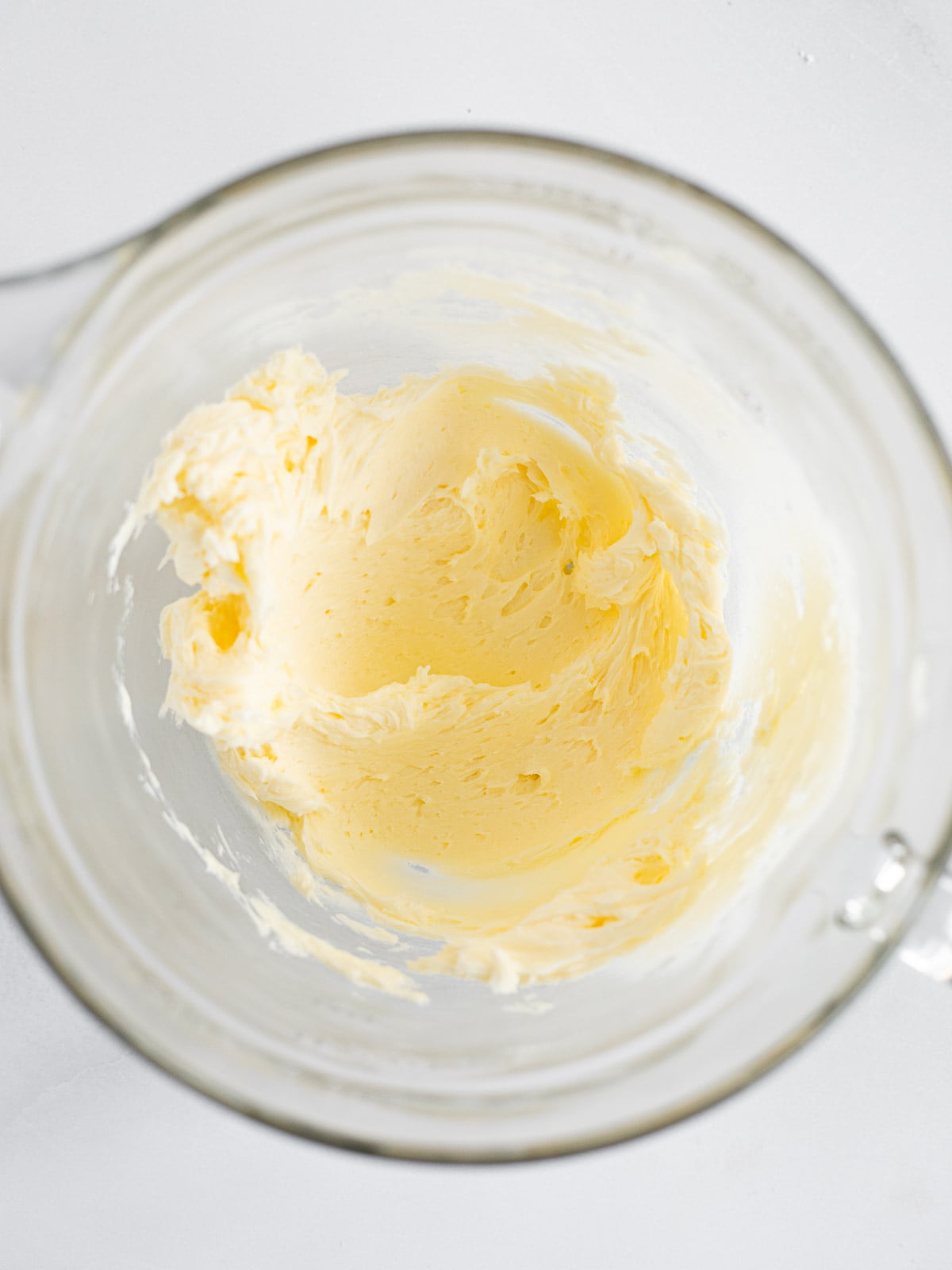 creamed butter in a glass bowl.