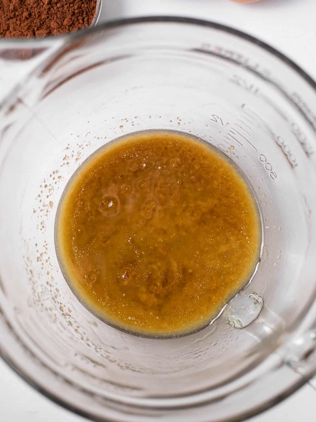 melted butter and brown sugar mixed in a glass bowl.