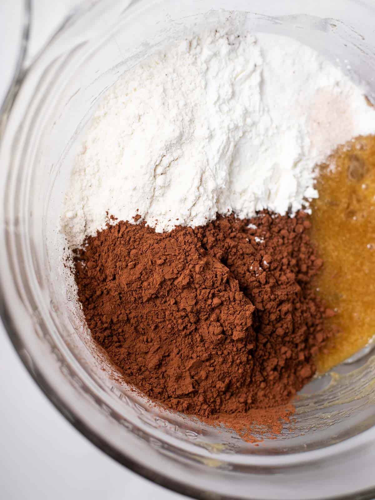 gluten free flour and cocoa powder in a glass bowl.