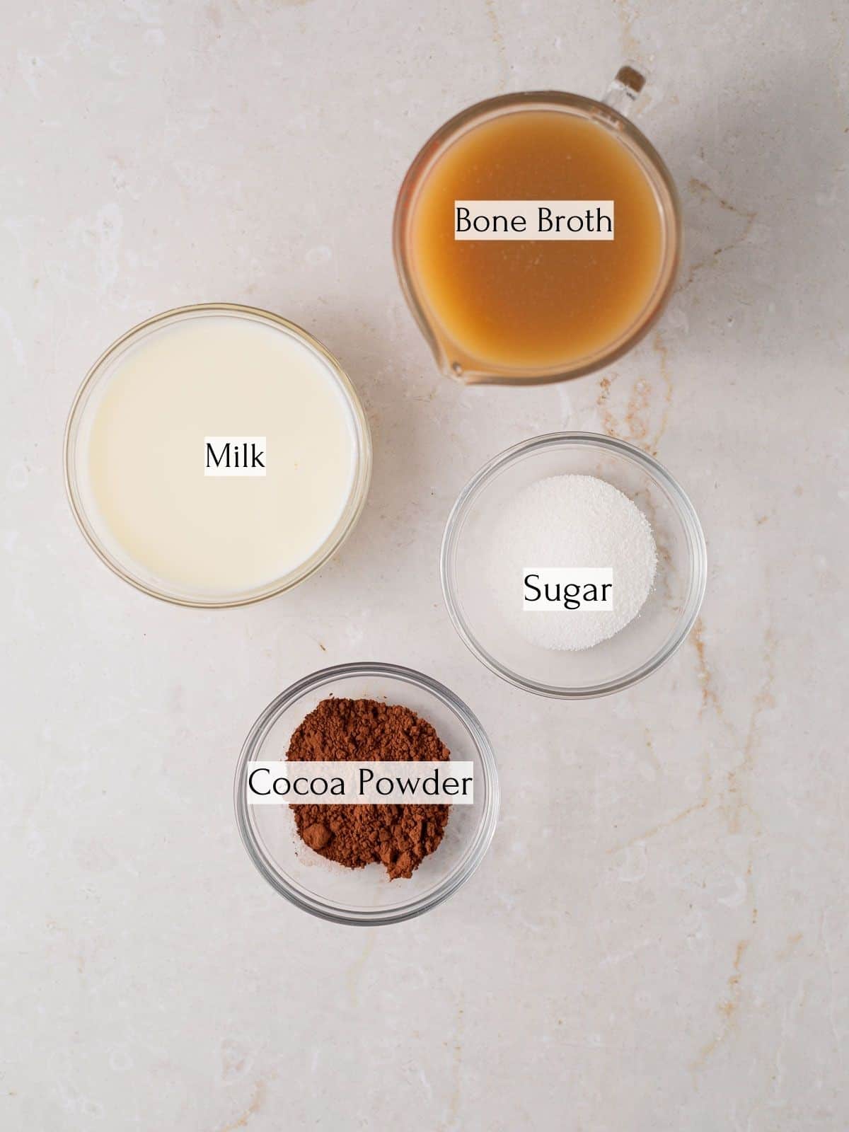 ingredients to make bone broth hot chocolate labeled with white text boxes.