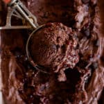 Dark Chocolate Raspberry Ice Cream scoop in a pink ice cream scooper.