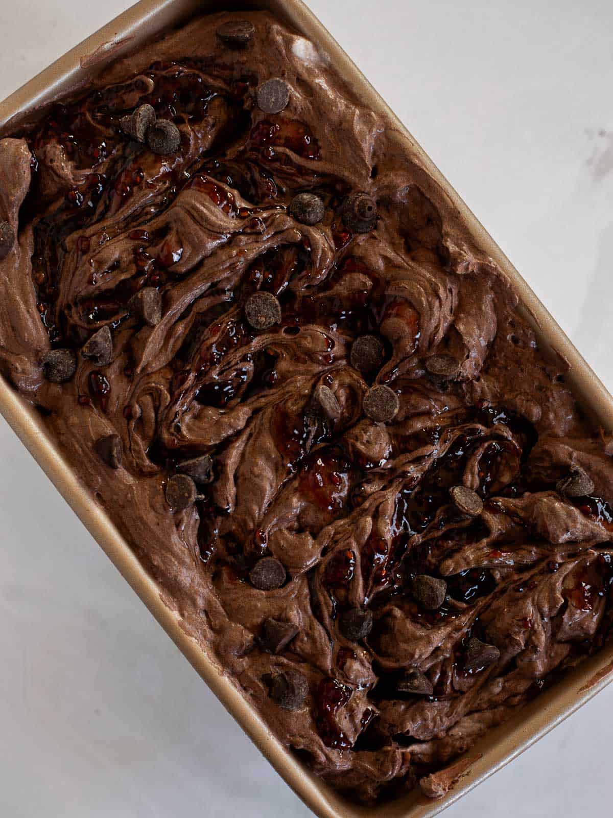 no churn Dark Chocolate Raspberry Ice Cream in a loaf pan.