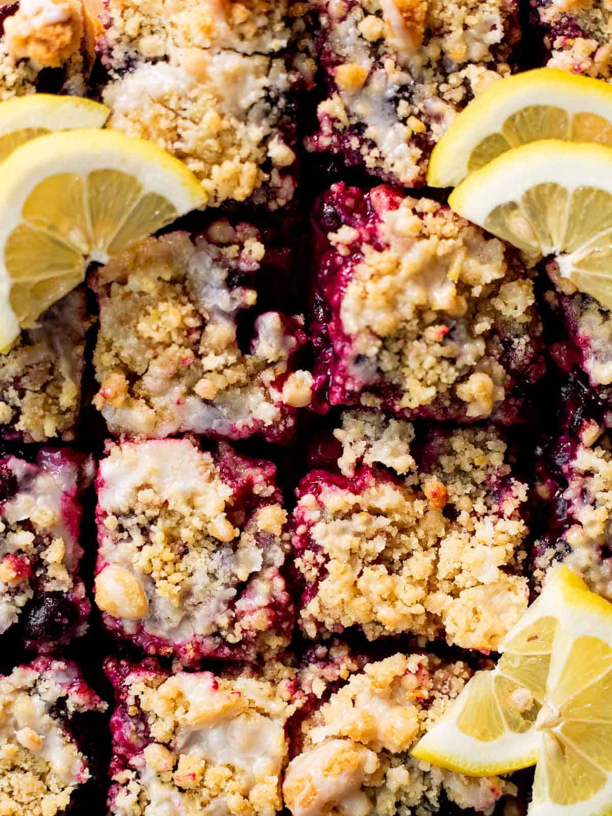 overhead cropped photo of lemon blueberry shortbread bars cut into squares.