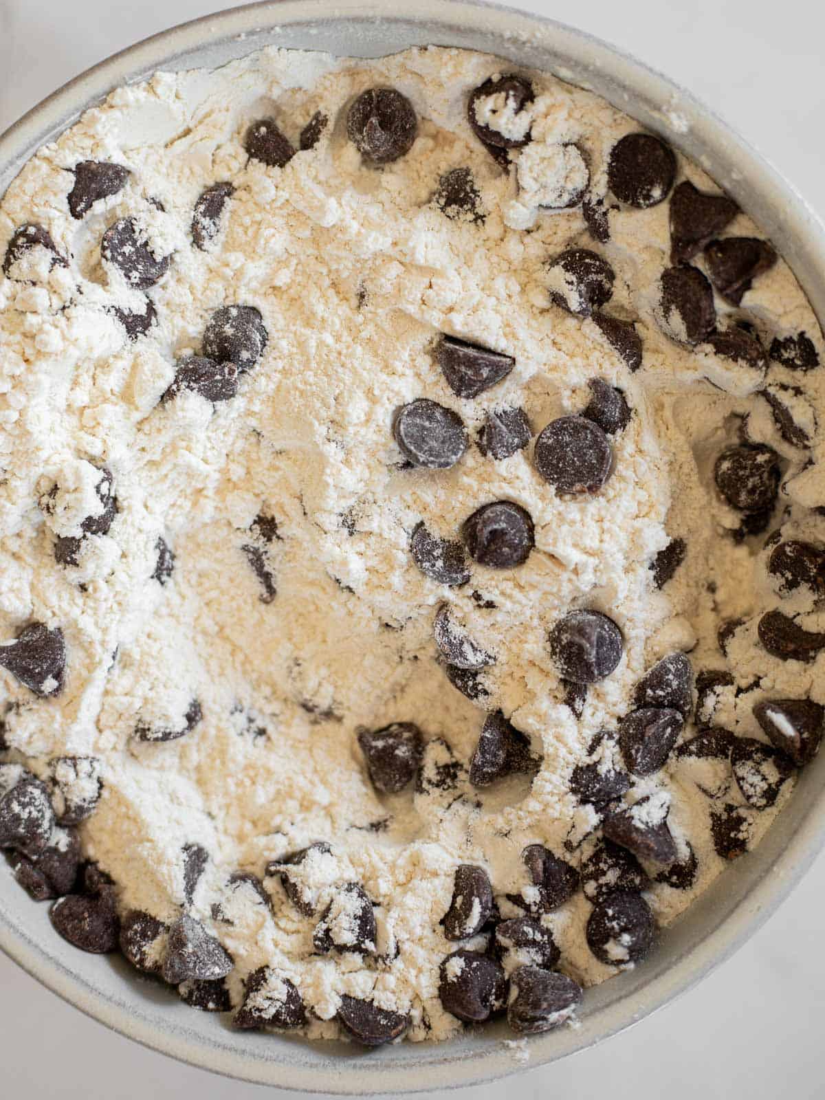 flour, baking soda, and chocolate chips whisked together.